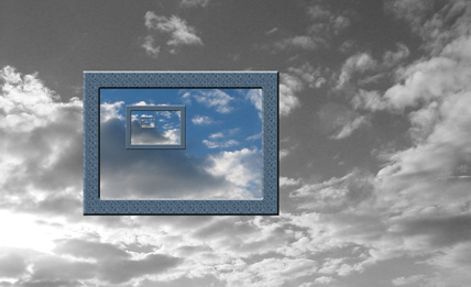 Computer monitor with clouds in the background